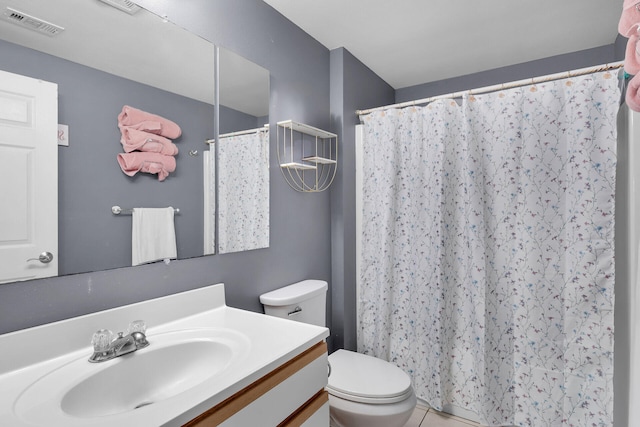 bathroom with toilet, a shower with curtain, visible vents, tile patterned flooring, and vanity
