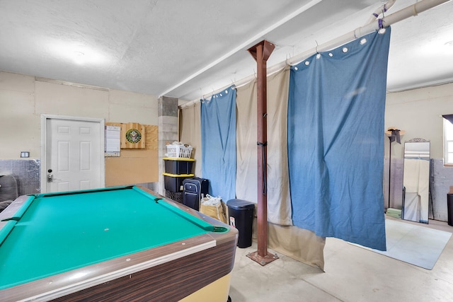 playroom with pool table and concrete flooring