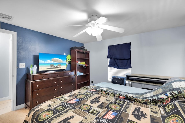 carpeted bedroom with ceiling fan and visible vents