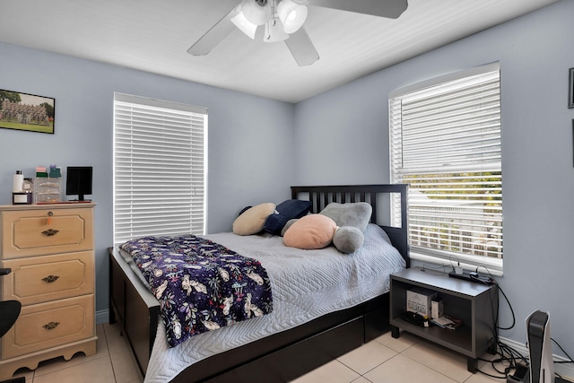 bedroom with a ceiling fan and light tile patterned floors
