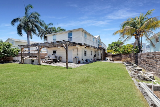 back of property featuring a pergola, a fenced backyard, a patio, and a yard