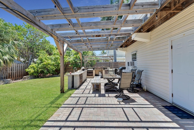view of patio featuring an outdoor kitchen, a pergola, a fenced backyard, and outdoor dining area