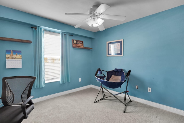 sitting room featuring carpet flooring, baseboards, and a healthy amount of sunlight