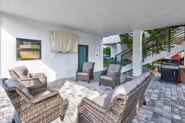 view of patio featuring outdoor lounge area and grilling area