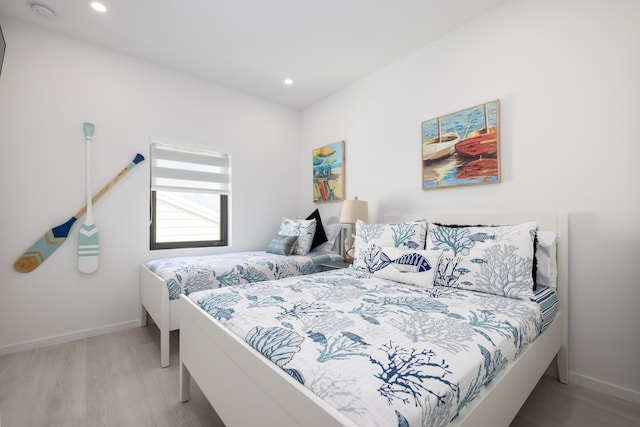 bedroom with light hardwood / wood-style floors