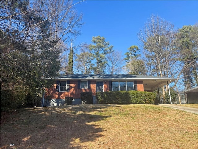 ranch-style home featuring an attached carport, brick siding, driveway, and a front lawn