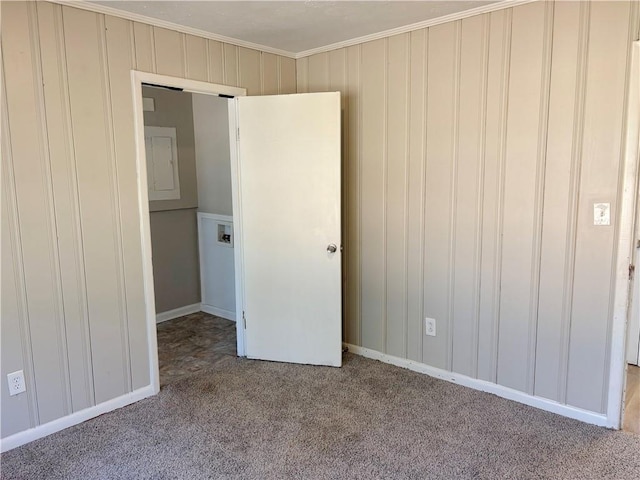 unfurnished bedroom featuring carpet floors and crown molding