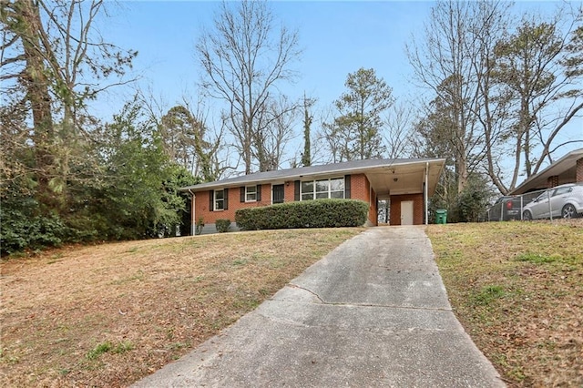 ranch-style house with a carport and a front lawn