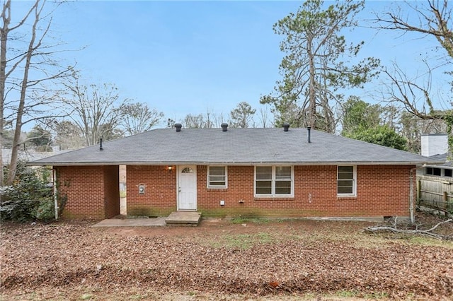 view of front of home with fence and brick siding