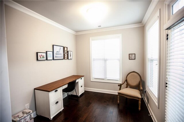 office area with a healthy amount of sunlight, ornamental molding, and dark hardwood / wood-style flooring