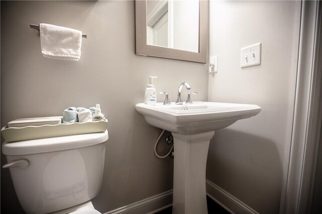 bathroom with sink and toilet