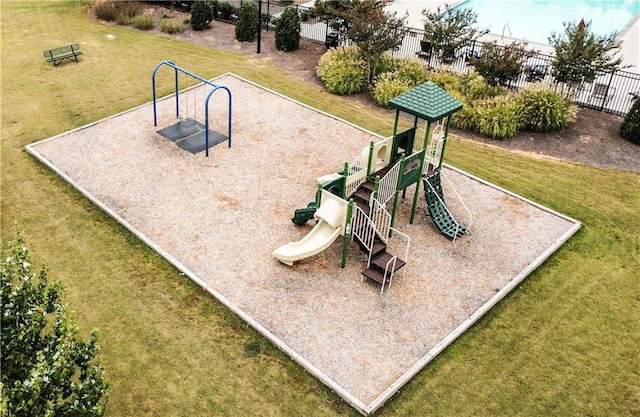 view of jungle gym featuring a lawn