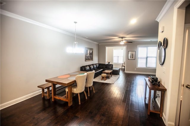 dining area with ceiling fan, ornamental molding, and dark hardwood / wood-style flooring