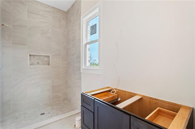 bathroom featuring a tile shower