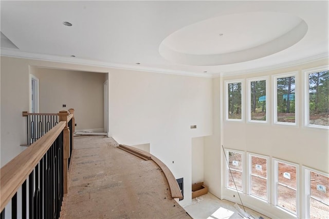 hallway with a healthy amount of sunlight and crown molding