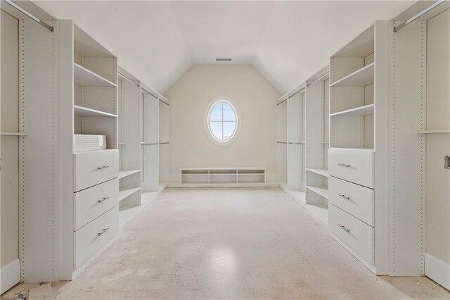 walk in closet with lofted ceiling and visible vents