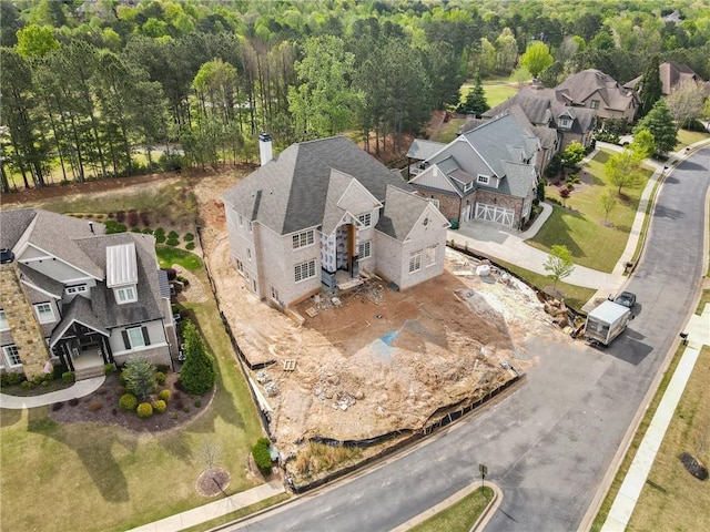 aerial view with a view of trees and a residential view