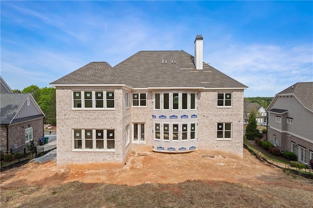 5694 Brendlynn Dr, Suwanee, GA 30024 - rear view of property featuring a chimney and brick siding