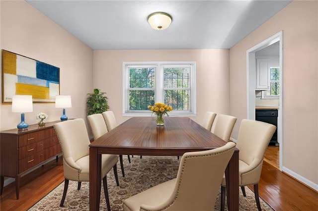 dining area with hardwood / wood-style floors