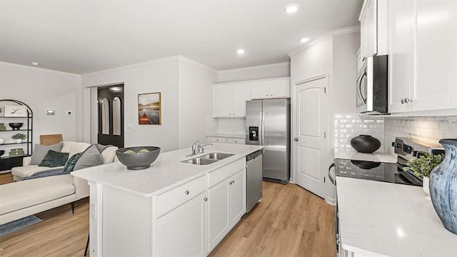 4954 Jatoba Rd Unit 72, Acworth, GA 30101 - kitchen with stainless steel appliances, a sink, light wood-type flooring, crown molding, and white cabinets