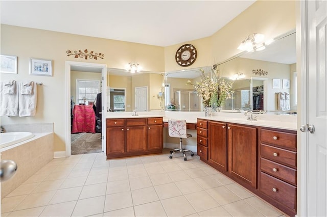 full bath with vanity, tile patterned flooring, a stall shower, and a bath