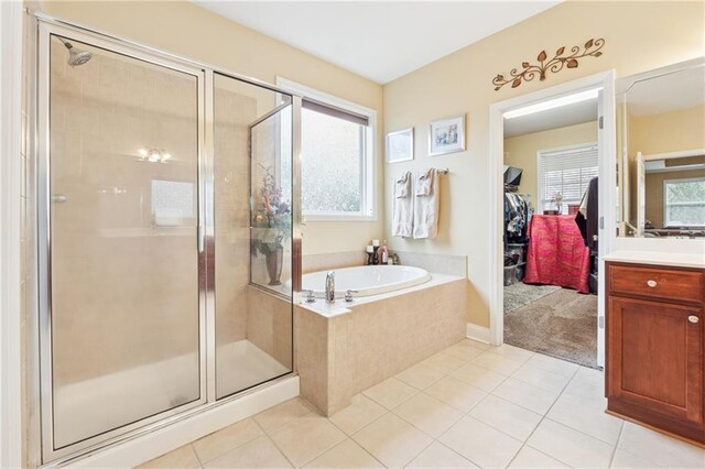 1527 Sage Ridge Dr, Marietta, GA 30064 - bathroom featuring vanity, tile patterned floors, healthy amount of natural light, and a bath