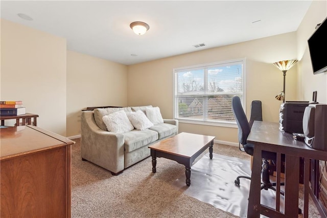 home office featuring carpet floors, baseboards, and visible vents