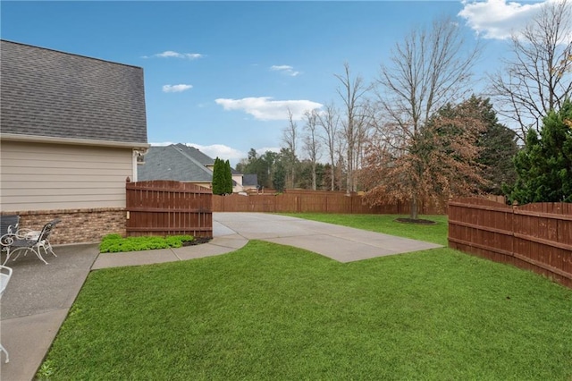 view of yard featuring a patio and fence