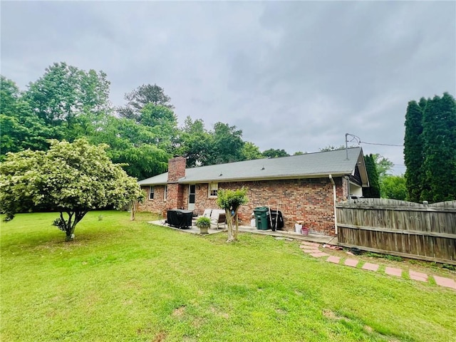 31 Cline Dr SW, Cartersville, GA 30120 - rear view of property featuring a patio area, a chimney, and brick siding