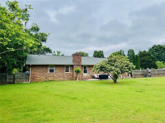 31 Cline Dr SW, Cartersville, GA 30120 - back of house featuring a chimney and brick siding