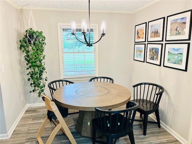 31 Cline Dr SW, Cartersville, GA 30120 - dining space featuring baseboards, light wood-style flooring, a chandelier, and ornamental molding