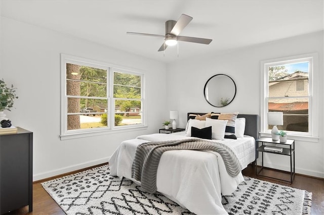 bedroom with dark wood-type flooring and ceiling fan