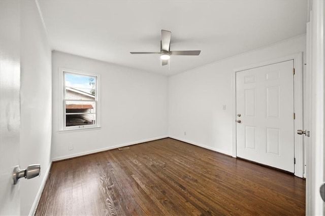 empty room featuring dark hardwood / wood-style floors and ceiling fan