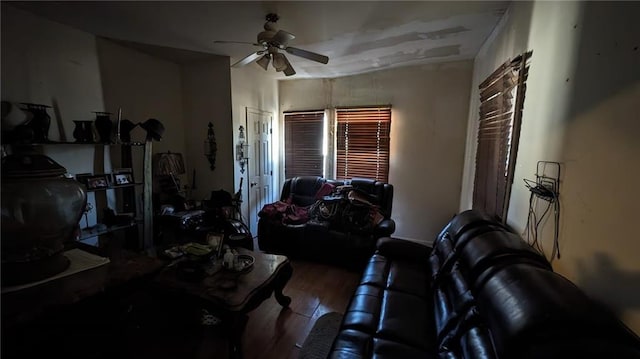 living room featuring wood-type flooring and ceiling fan