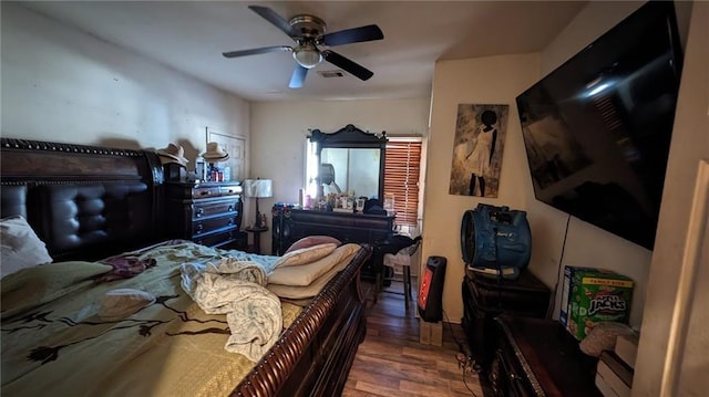 bedroom with ceiling fan and hardwood / wood-style floors