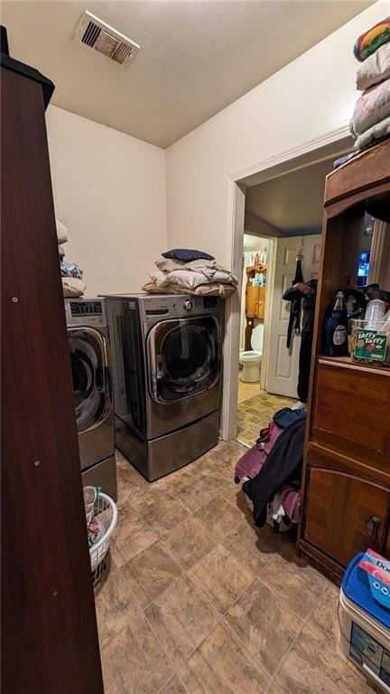 washroom with washing machine and dryer