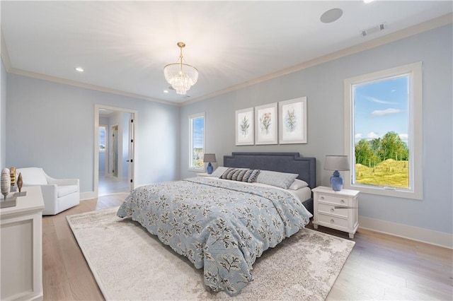 bedroom with ornamental molding, light hardwood / wood-style flooring, and a notable chandelier