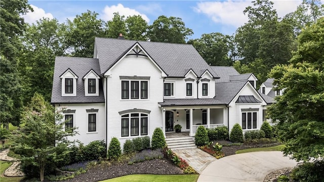 15595 Birmingham Hwy, Alpharetta, GA 30004 - view of front facade featuring a porch, a standing seam roof, and a metal roof