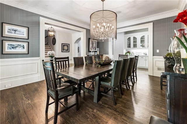 15595 Birmingham Hwy, Alpharetta, GA 30004 - dining area featuring crown molding, a chandelier, a wainscoted wall, stairs, and arched walkways