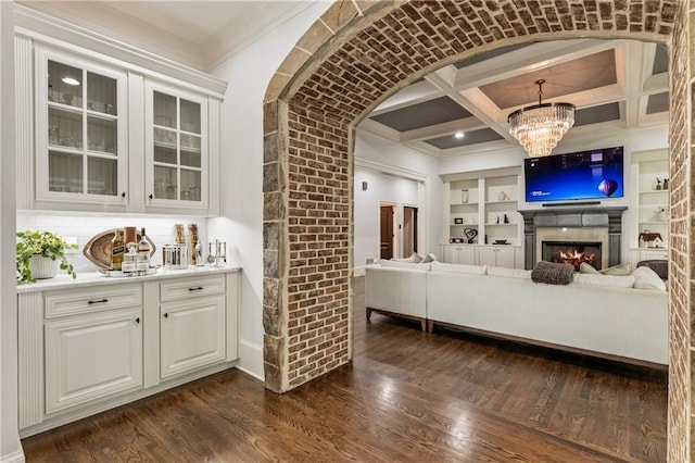 15595 Birmingham Hwy, Alpharetta, GA 30004 - bar featuring ornamental molding, a chandelier, coffered ceiling, dark wood-style floors, and built in shelves