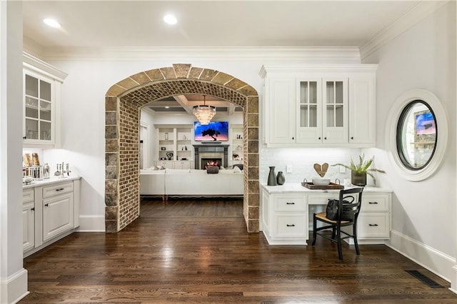 15595 Birmingham Hwy, Alpharetta, GA 30004 - kitchen with dark wood finished floors, white cabinets, glass insert cabinets, and ornamental molding