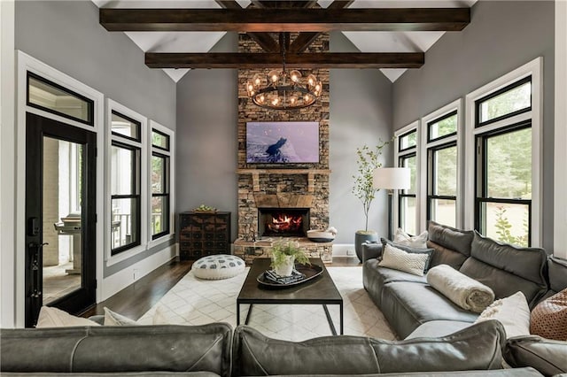 15595 Birmingham Hwy, Alpharetta, GA 30004 - living room with beamed ceiling, a chandelier, high vaulted ceiling, wood finished floors, and a fireplace