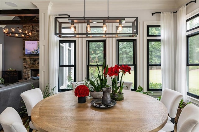15595 Birmingham Hwy, Alpharetta, GA 30004 - dining space with a chandelier, ornamental molding, and a fireplace