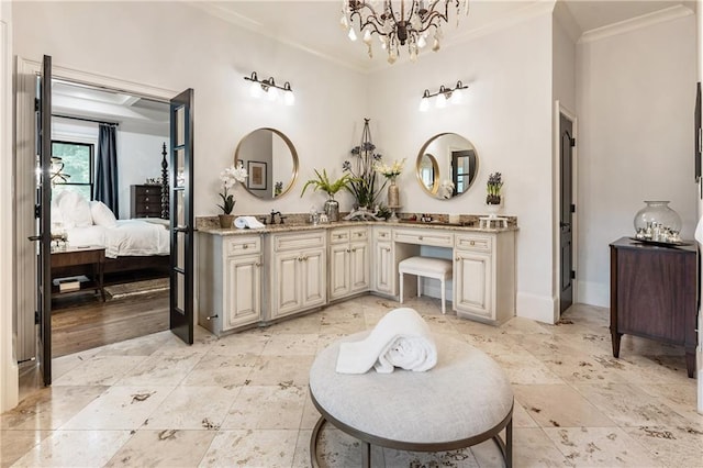 15595 Birmingham Hwy, Alpharetta, GA 30004 - bathroom featuring ornamental molding, double vanity, connected bathroom, and a chandelier