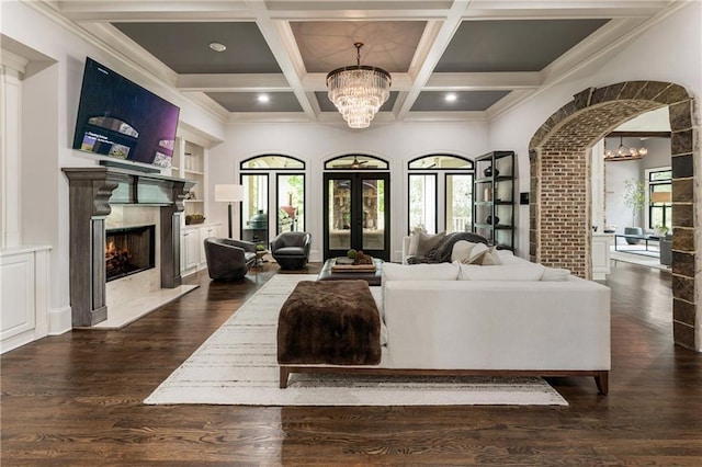 15595 Birmingham Hwy, Alpharetta, GA 30004 - living room with a chandelier, a high end fireplace, dark wood finished floors, beam ceiling, and coffered ceiling