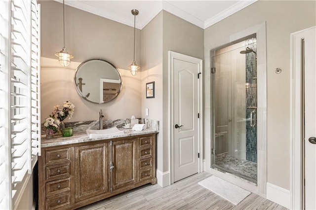 15595 Birmingham Hwy, Alpharetta, GA 30004 - bathroom with vanity, a stall shower, crown molding, and wood finished floors