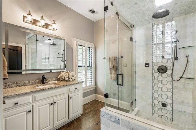 15595 Birmingham Hwy, Alpharetta, GA 30004 - full bath with a stall shower, vanity, and wood finished floors