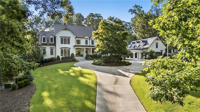 15595 Birmingham Hwy, Alpharetta, GA 30004 - view of front facade featuring curved driveway, a front yard, and stucco siding