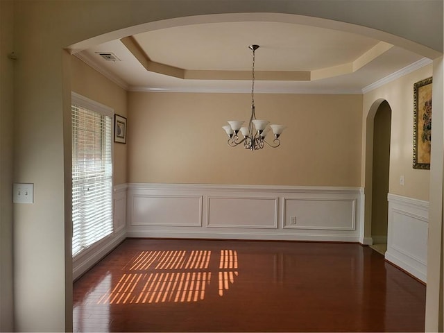 1080 Colgan Ct, Alpharetta, GA 30004 - unfurnished dining area featuring a raised ceiling, plenty of natural light, wood finished floors, ornamental molding, and a wainscoted wall