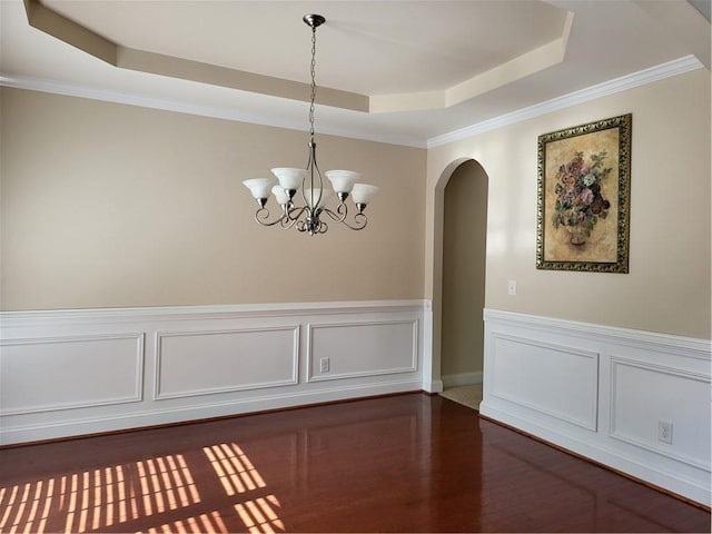 1080 Colgan Ct, Alpharetta, GA 30004 - unfurnished dining area featuring a raised ceiling, arched walkways, dark wood finished floors, a chandelier, and ornamental molding